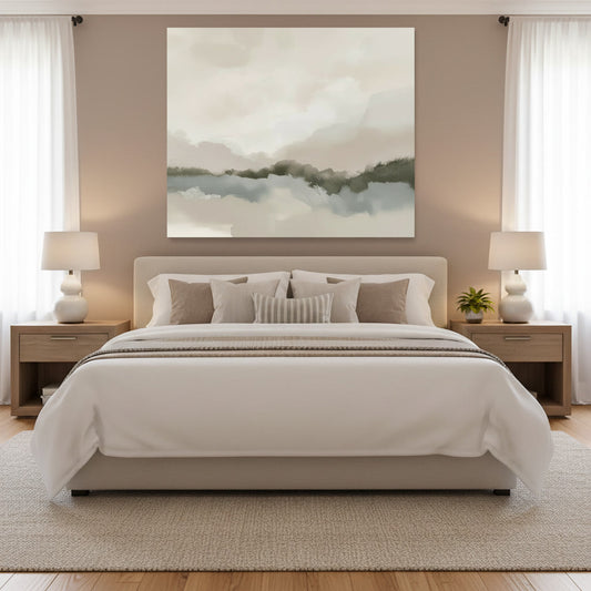 Neatly made bed with decorative pillows in a bedroom setting with wall art and lamps.